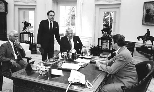 West (standing), along with Broadcasting magazine Chief Correspondent Len Zeidenberg (l) and Publisher Larry Taishoff, visited President Ronald Reagan in the Oval Office in June 1987 after Reagan vetoed legislation codifying the fairness doctrine into law. Later that summer, the FCC deleted the doctrine from its regulations.